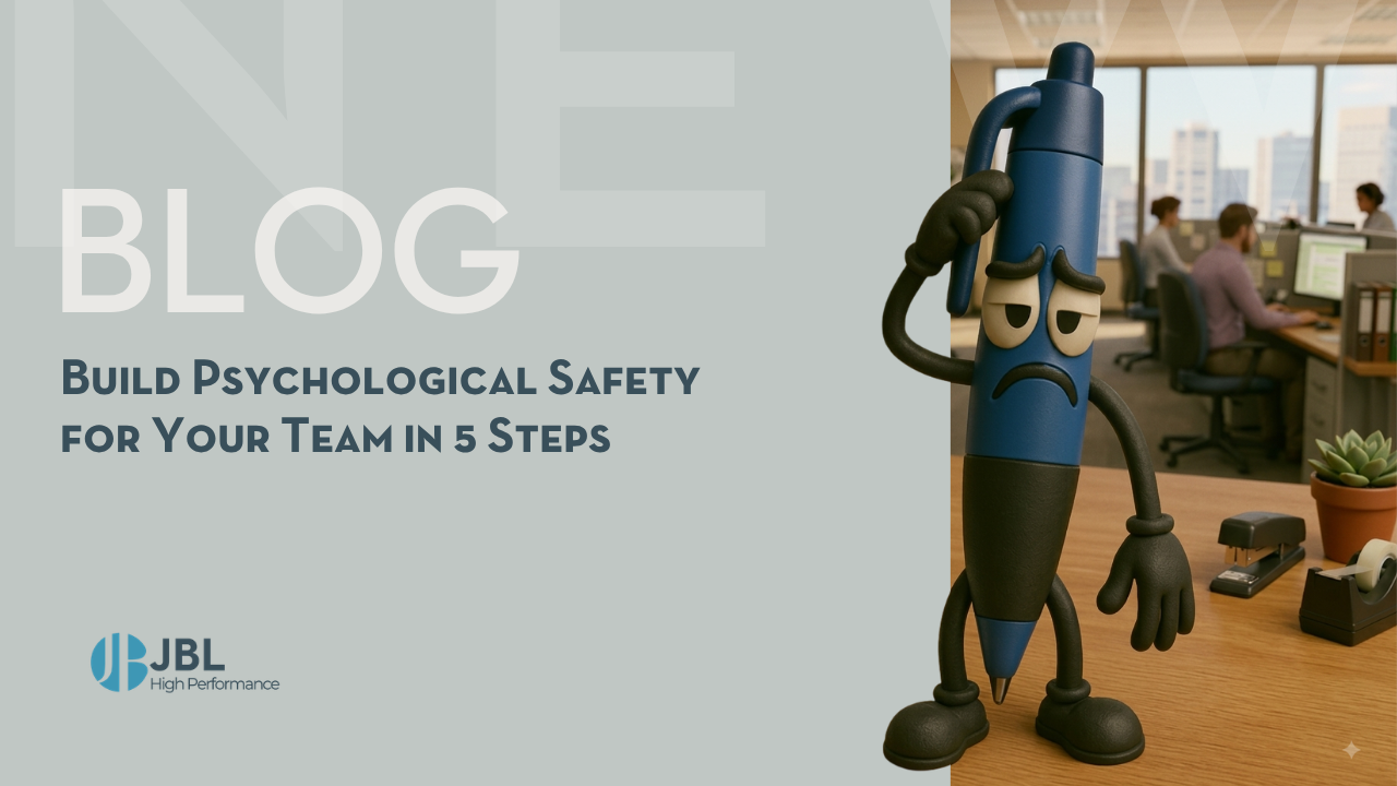 A worried animated pen character stands on an office desk with colleagues working in the background, highlighting team psychological safety.